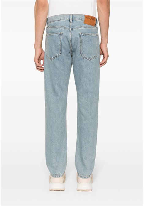 Jeans dritti con applicazione Moschino | ZRA035220220294